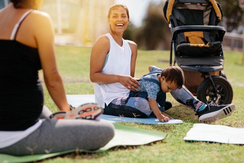 mom with her son during yoga in the park