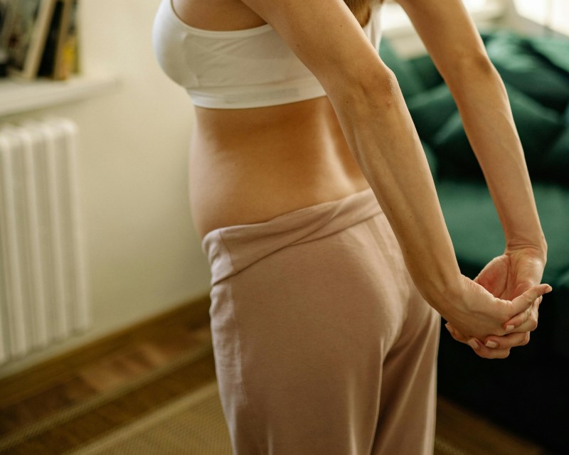 Postpartum stretches can help for back pain, that is if new moms don't take it too far.