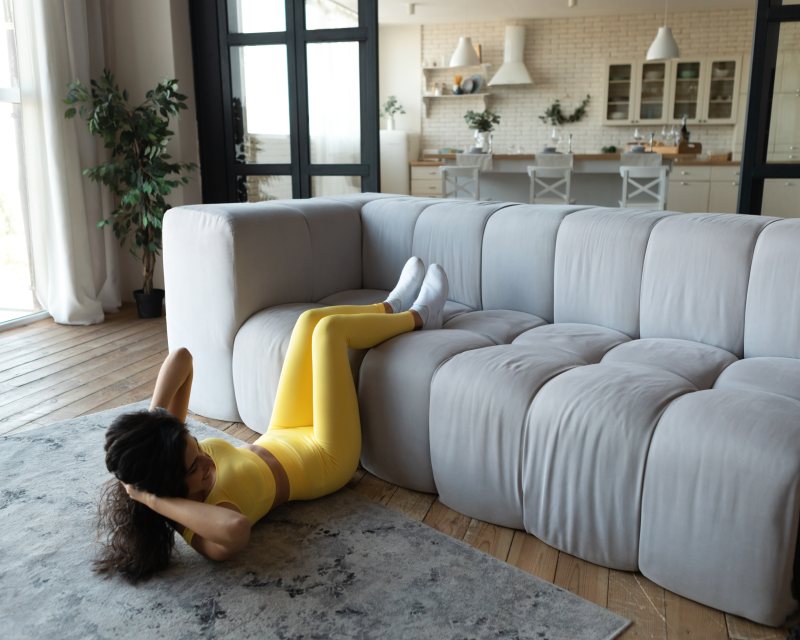 Mom finding relief with this lower back relaxation postpartum stretch