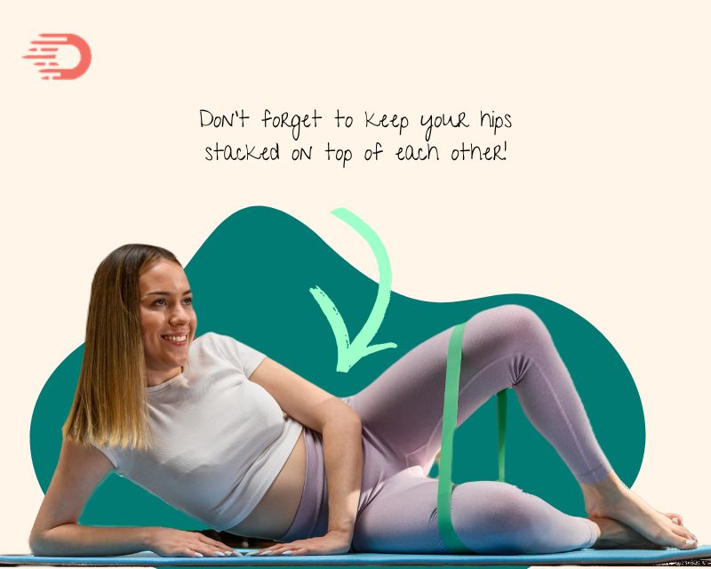 happy mom doing clamshells for postpartum workout