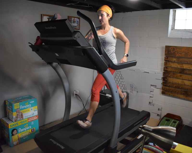 Mom following a sample 10-minute treadmill workout plan
